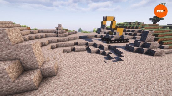 minecraft-builds-gravel-pit Best Minecraft builds: A yellow and gray digger on a large pit of gravel.