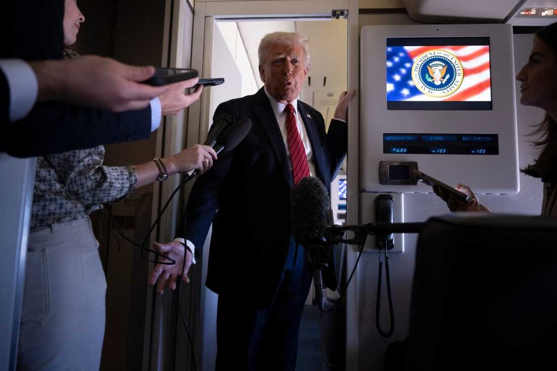 President Trump speaks to members of the press on Air Force One while flying over Saudi Arabia on his way to Qatar on Wednesday.