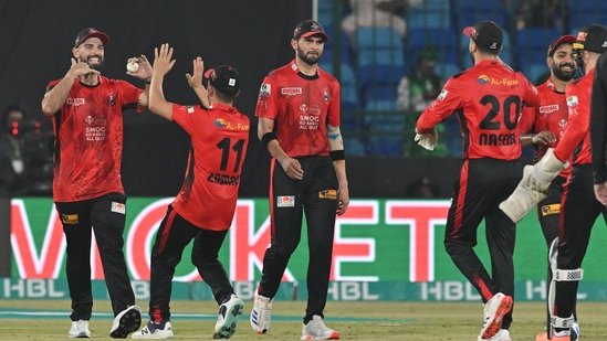 Lahore Qalandars' New Zealand all rounder Daryl Mitchell (L) with teammates(AFP) Lahore Qalandars' New Zealand all rounder Daryl Mitchell (L) with teammates(AFP)