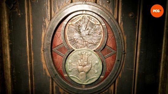 Two medallions are arranged in the Alone in the Dark crypt gate.