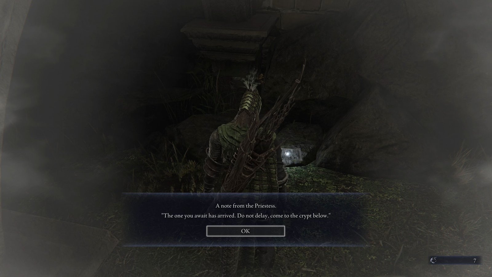 An Elden Ring Nightreign screenshot showing the Ironeye character reading a note left by the Priestess saying “The one you await has arrived. Do not delay, come to the crypt below”.