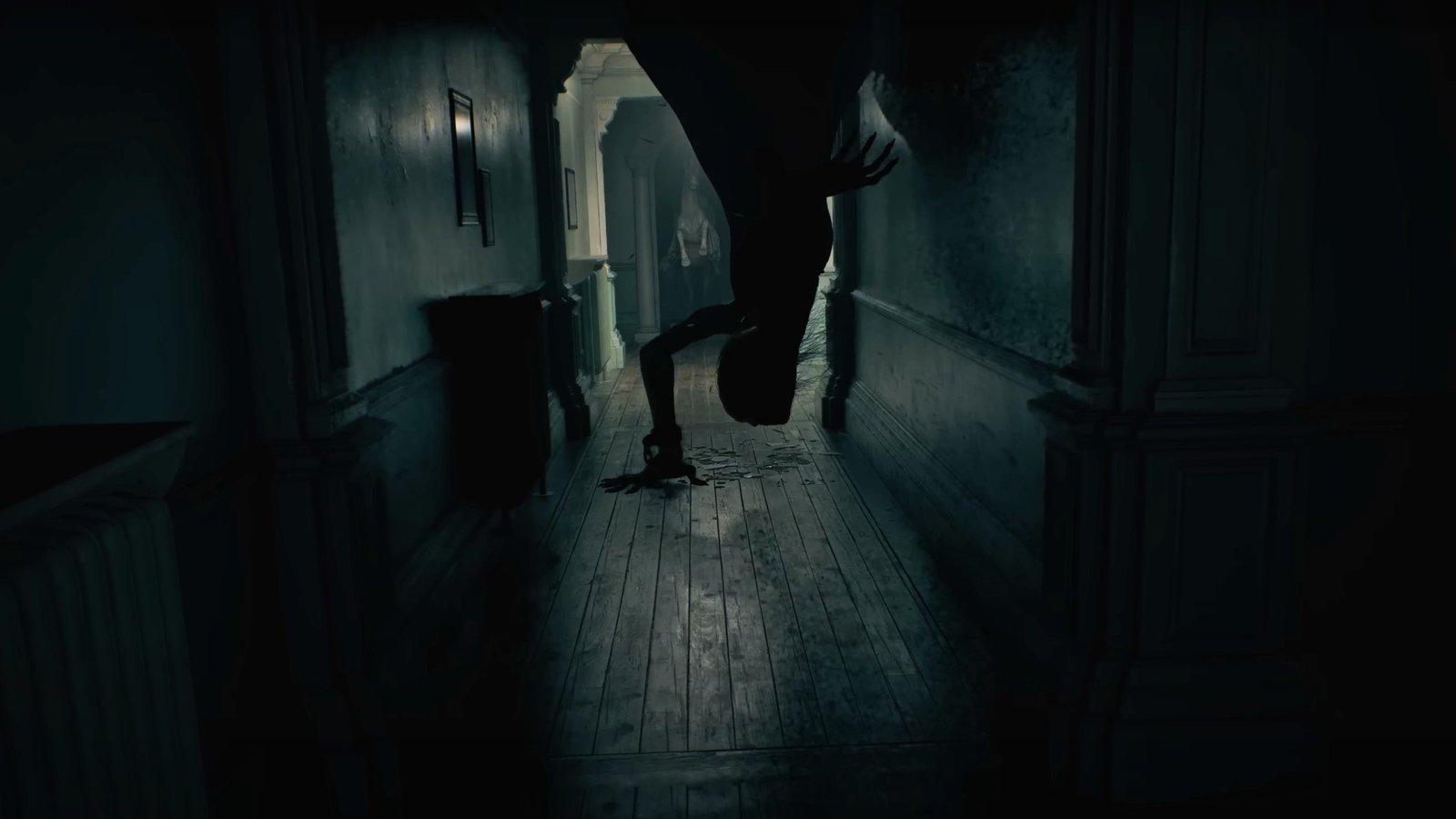 RE9 release date: A mutant crawls down from the ceiling to the floor in what appears to be the Wrenwood Hotel's corridor, a statue of a horse rearing standing in the doorway behind it.