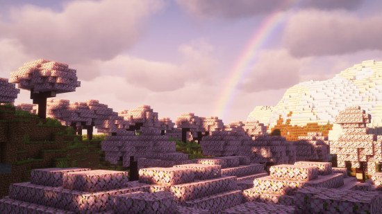 minecraft-shaders-complemtenary A pink sky and a rainbow over a cherry grove biome thanks to one of the best Minecraft shaders, Complementary.