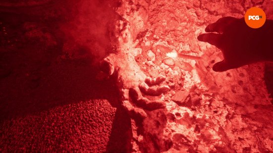 still-wakes-the-deep-dlc-review Still Wakes the Deep DLC review: Mhairi reaches down, a hand outstretched towards another that rests on the sea floor, a flare lighting everything in a neon red.