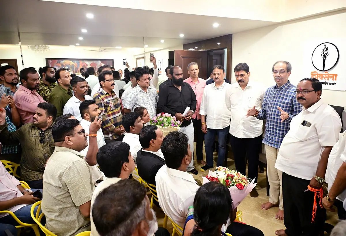 Shiv Sena (UBT) chief and former Maharashtra Chief Minister Uddhav Thackeray interacts with Dharavi residents at his residence “Matoshree” in Mumbai on May 25, 2025. For the Shiv Sena (UBT), the BMC elections later this year will be a battle for political survival.
