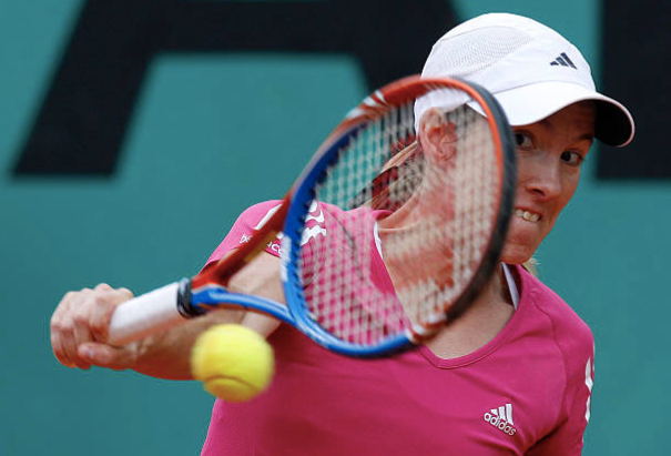 Justine Henin hitting her one-handed backhand. 