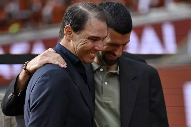 PARIS, FRANCE - MAY 25: Serbian tennis player Novak Djokovic (R) attends the tribute ceremony held in Spanish tennis legend Rafael Nadal's (L) honor on the first day of the French Open (Roland Garros) Grand Slam tournament in Paris, France, on May 25, 2025. Nadal, a 14-time French Open champion, holds the record for the most titles at a single Grand Slam and has won a total of 22 Grand Slam titles throughout his career, becoming the first male player to do so. (Photo by Burak Akbulut/Anadolu via Getty Images)