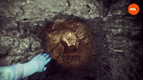still-wakes-the-deep-dlc-review-the-descent Still Wakes the Deep DLC review: Mhairi squeezes through a claustrophobic passage in the rock, remnants of the Beira D scattered on the floor.