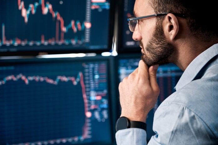 urlhttps3A2F2Fg.foolcdn.com2Feditorial2Fimages2F8339822Fthinking-in-front-of-trading-screen.jpeg